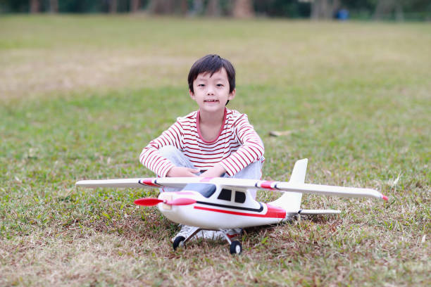 Boy hand holding a toy plane