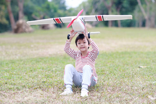 Boy hand holding a toy plane