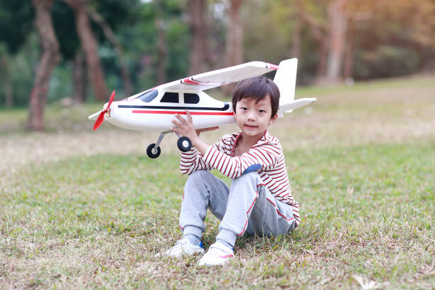 Boy hand holding a toy plane