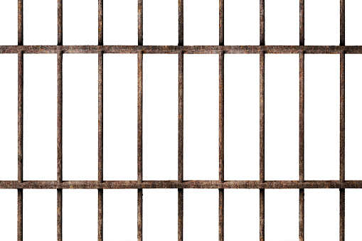 Old prison rusted metal bars cell lock isolated on white