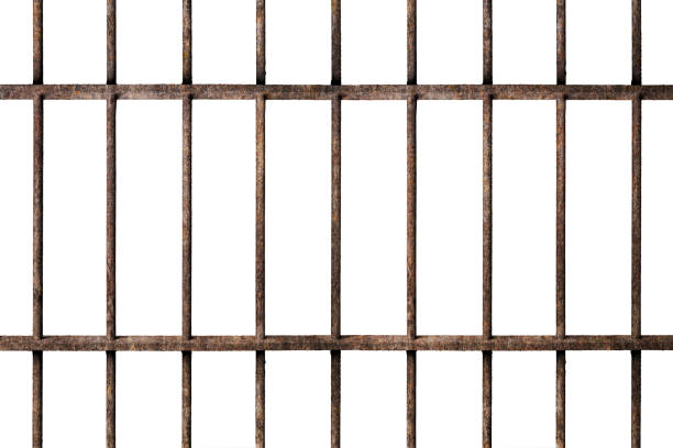 Old prison rusted metal bars cell lock isolated on white Old prison rusted metal bars cell lock isolated on white background jail stock pictures, royalty-free photos & images