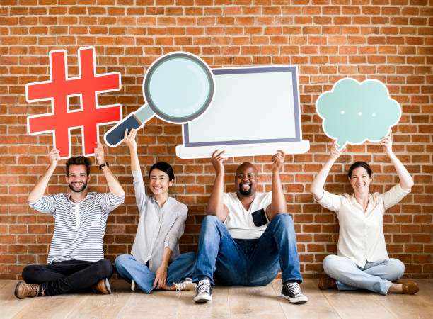 istock Diverse people holding social icons 1072315838