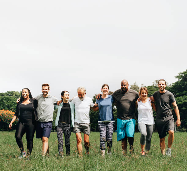 Group of people hugging each other in the park