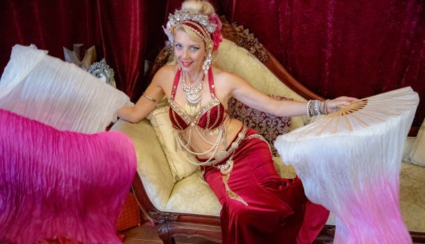 istock Mature Macedonian belly dancer rehearses her routine in a studio. 1072323538