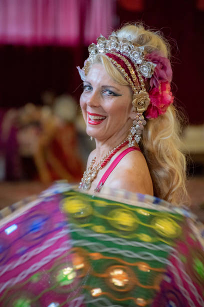 istock Laughing Mature Macedonian belly dancer rehearses her routine in a studio. 1072324946