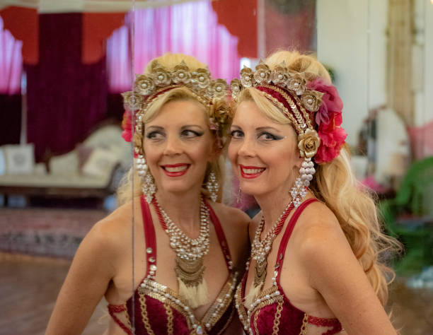 istock Macedonian belly dancer rehearses with her own image in a dancers mirror. 1072325366