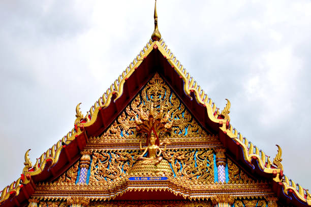 istock Gold Buddhist temple against a grey sky 1072328050