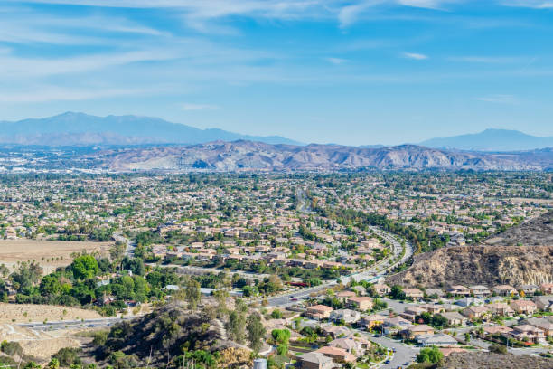 istock Road into city on fall day 1072328106