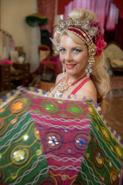 istock Middle aged Macedonian belly dancer rehearses her routine in a studio. 1072329274