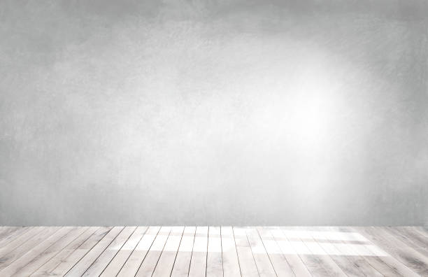 istock Light green wall in an empty room with a wooden floor 1072329894