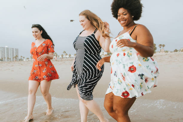 istock Curvy women at the beach 1072330134