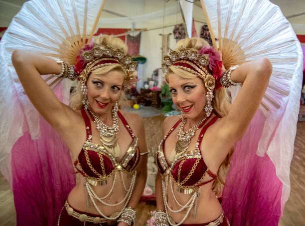 istock Macedonian belly dancer rehearses with her own image in a dancers mirror. 1072330156
