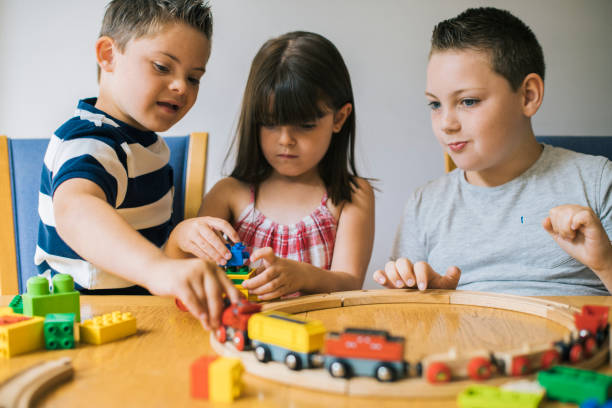 istock Siblings playing with blocks, trains and cars 1072331324