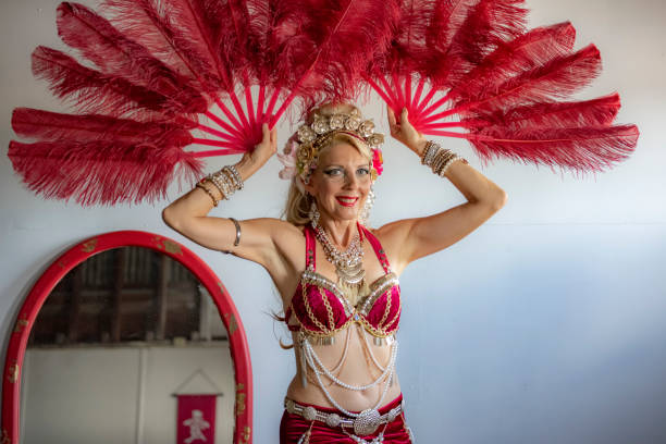 istock Middle aged Macedonian belly dancer rehearses her routine in a studio. 1072331500