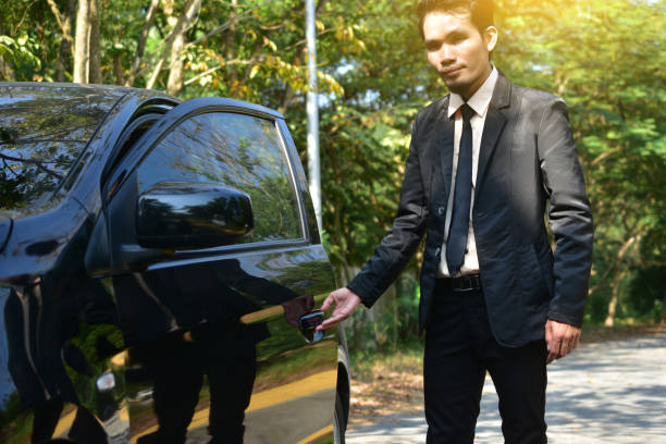 istock Man opening car door 1072335332