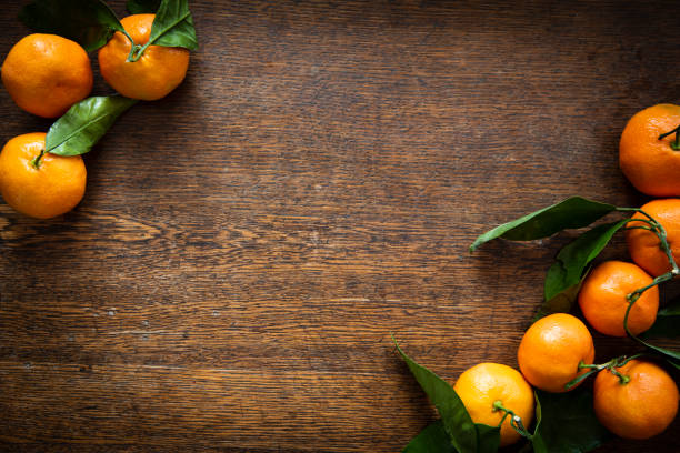 istock Satsuma Mandarins on an Wooden Table Background 1072335574