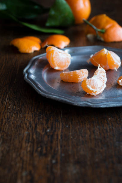 istock Satsuma Mandarins on an Wooden Table 1072335828