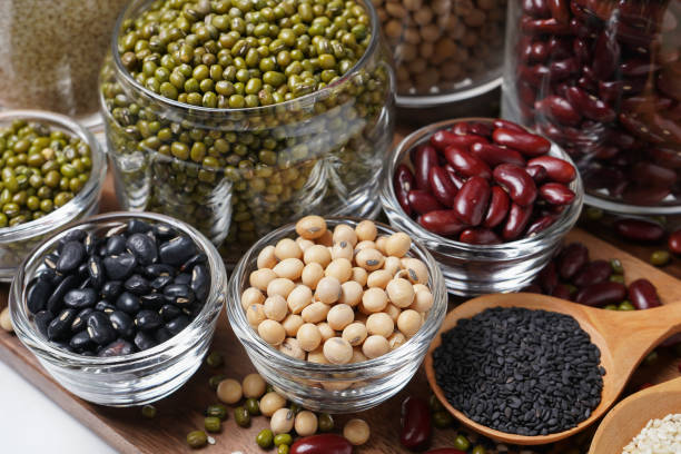 istock Many nuts and sesame seeds on wooden floor. 1072336016