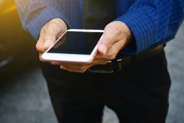 istock People are holding smart phone and using internet online communication and technology 1072338274
