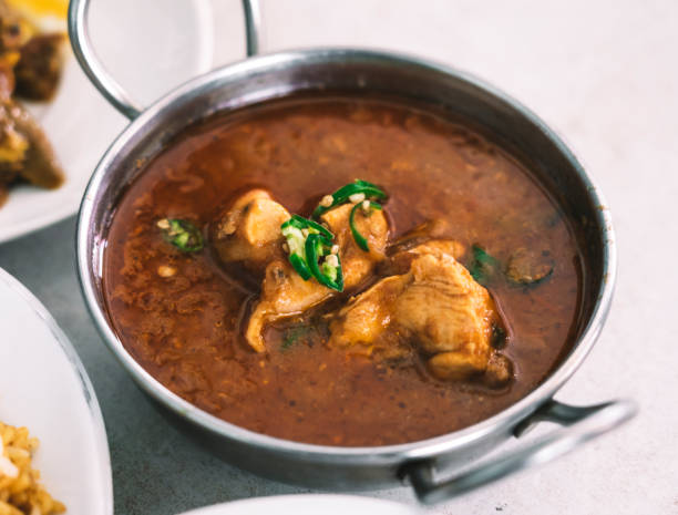 istock Chicken masala spicy curry recipe 1072346846