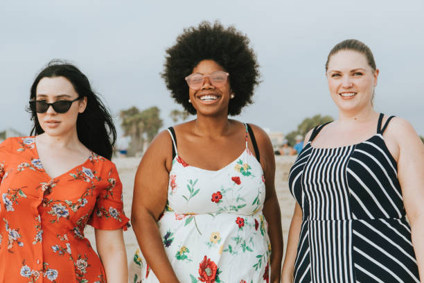 istock Cheerful diverse plus size women at the beach 1072347136