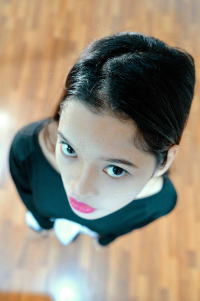 Beautiful woman posing - look up, facial expression, serious woman