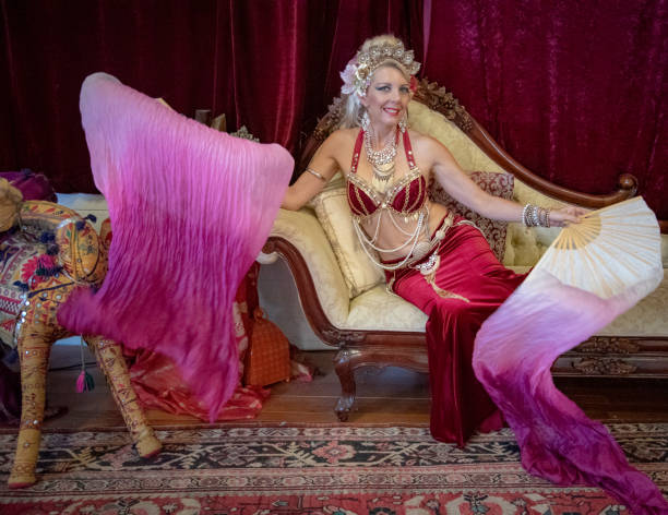 istock Middle aged Macedonian belly dancer rehearses her routine in a studio. 1072354238