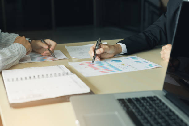 istock Business people working on desk and analysis summary chart with calculated about cost at office room. 1072359550