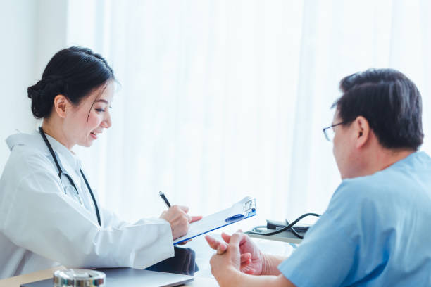istock Doctor women standing talking old patient men 1072361400