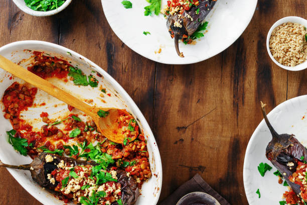 Healthy vegetarian food baked stuffed eggplant lentils copy space top view