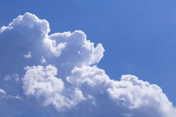istock Blue sky background with white clouds. The vast blue sky and clouds sky on sunny day. White fluffy clouds in the blue sky. 1072364202