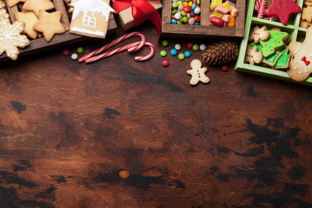 istock Christmas card with sweets, gift box and cookies 1072368950