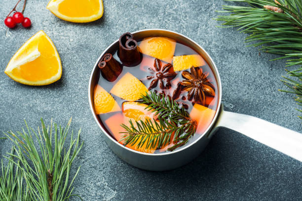 istock Christmas mulled wine with spices and fruit on the table. New year concept 1072369336