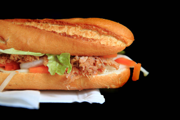 istock baguette on the black background 1072369618