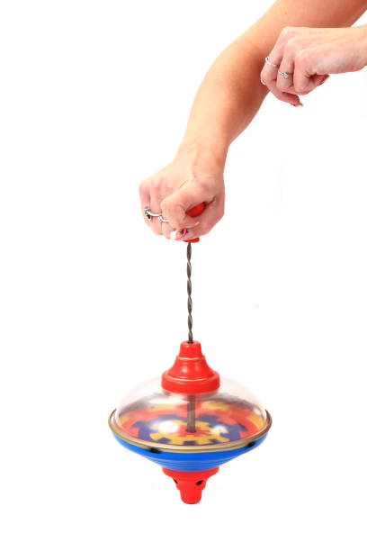 istock old whirligig in human hand 1072374408