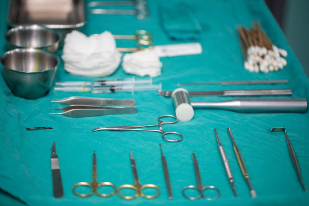 istock surgical instruments and tools including scalpels, forceps and tweezers arranged on a table for a surgery and vivisection . 1072375002