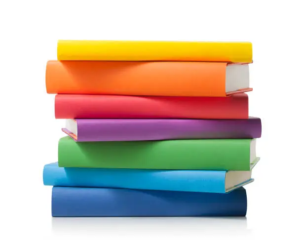 Photo of Stack of colored books on white background with clipping path