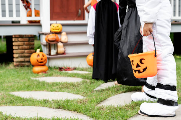 istock Young kids trick or treating during Halloween 1072377342