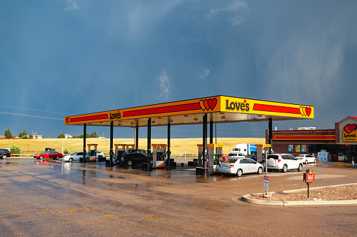 Denver,USA - July 18,2013: Love's gas station after heavy storm.Love's provides professional truck drivers and motorists with 24-hour access to clean and safe places to purchase gasoline, diesel fuel etc...