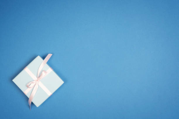 istock Christmas  holiday gift box,  on blue background. Flat lay 1072379702