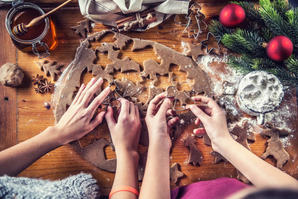 istock Gingerbread dough and young girls hands preparing christmas biscuit cakes. 1072380794