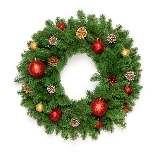 istock Christmas tree branches in a circle frame isolated on white background with copy space for text. Round wreath fir with Christmas toy balls and fir cones. Flat lay 1072381304