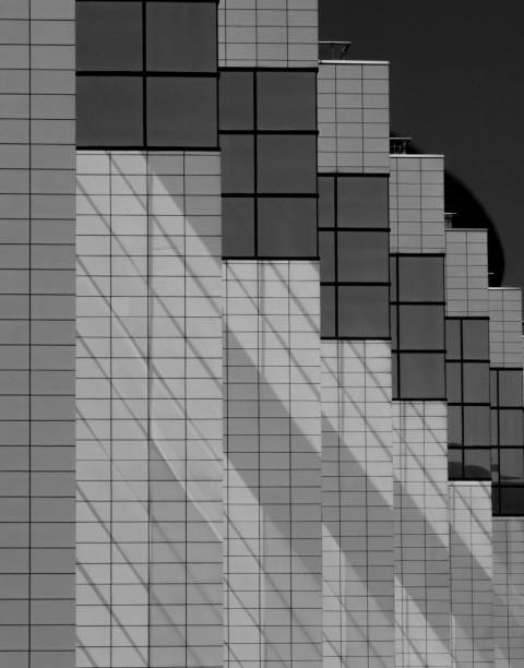 istock Sequence of windows. shadows and walls of modern building 1072381392