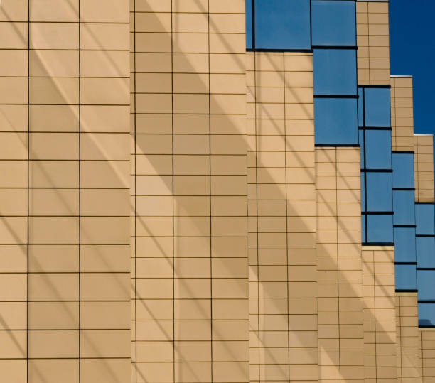 istock Sequence of windows. shadows and walls of modern building 1072381402