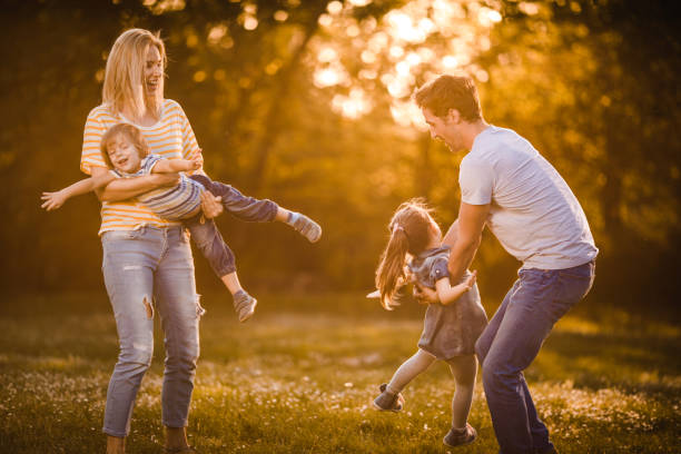 istock Playful family having fun during springtime in nature. 1072381740