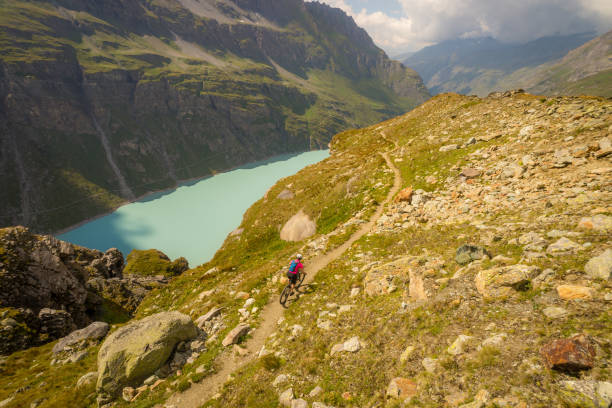 istock Mountain biking in the Alps scenery 1072387840