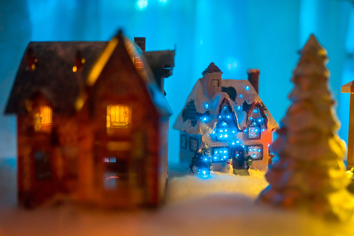 Christmas decoration toy city. Close-up with Christmas illumination