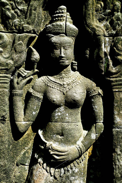Apsara dancer carved on a wall of Ta Prohm temple at Angkor, Siem Reap province, Cambodia.