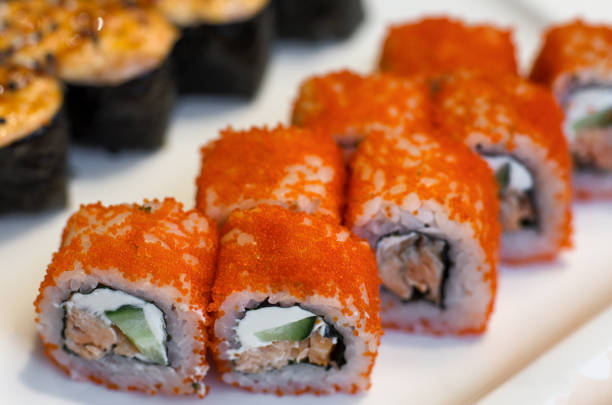 istock Orange sushi rolls California 1072399204