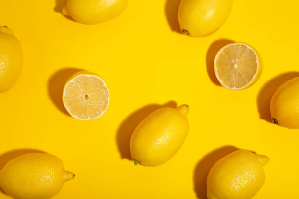 istock Fresh lemon on yellow background. Tropical fruit. 1072399638